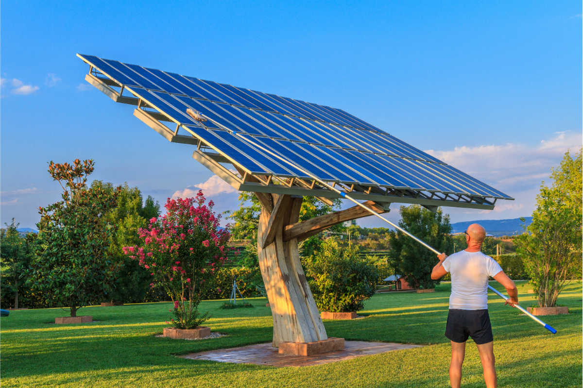 professional cleaning a solar panel thoroughly